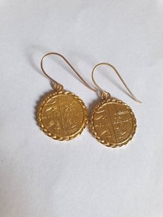 14k gold earrings, coin earrings, dangle coin earrings, coin pendant earrings, antique coin earrings, gold drop earrings, gold coin earrings. Coin earrings, delicate and beautiful, made of an old British coin attached to a 14k gold filled hook, making them a great pair of gold dangle earrings for everyday wear. The coin earrings is made of an original coin which I decorated with twisted wires and plated with 14k gold. Dimensions: The earrings diameter is about 0.7 inch (1.8 cm). The drop length, Gold Coin Necklace, Antique Coins, Great Gifts For Women, Coin Earrings, Antique Necklace, Gold Coins, Coin Necklace, Gold Earrings Dangle, Coin Pendant