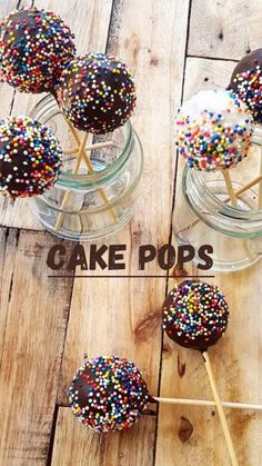 chocolate covered cake pops with sprinkles on sticks