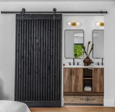 an open sliding door in a bathroom next to a sink