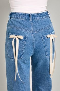 Light wash high waisted straight leg denim pants with bow detailing on back pockets! -Model is 5’8 and is wearing a small -Materials: 100% cotton Pants With Bow, Bow Jeans, Unique Jeans, Chic Romper, Kimono Sweater, Denim Chic, Straight Leg Denim, Trendy Clothes For Women, Cozy Knits