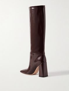 Find GIANVITO ROSSI Vanta 95 Patent-leather Knee Boots on Editorialist. Gianvito Rossi's 'Vanta' knee boots are designed with careful attention to fit and shape, so they're minimal yet modern. They're made from glossy patent-leather that slouches ever-so-gently at the ankle and have square toes and sturdy block heels. Fans of the brand will recognize the gold-tone ribbon logo. Luxury Patent Leather Heeled Boots For Fall, Brown Leather Knee-high Boots For Evening, Ribbon Logo, Leather Knee Boots, Patent Boots, Patent Leather Boots, Slouched Boots, Black Suede Boots, Leather Boots Women