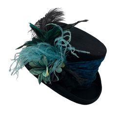 "Black 100% felt Top Hat with silk print textured band around the crown in turquoise.  There are beautiful turquoise and black flowers, along with turquoise and black ostrich feathers. The crown of the hat is lined in satin with a stretchy sweatband for a better fit.  #7853 Please measure your head before ordering. Returns are not accepted if you order the wrong size. Message me with any questions if you have any questions at all.  SIZES:  M     21 3/4\" - 22 1/4″               L     23\" - 23 1 Wedding Top Hat, Blue Top Hat, Top Hats For Women, Edwardian Costumes, Special Occasion Hats, Hat With Flowers, Black Straw Hat, Steampunk Top, Mad Hat