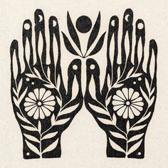 two black and white hands with flowers on them