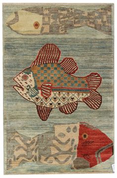 a rug with fish on it in the shape of a fish, and another fish that is