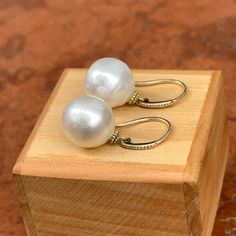 14KT Yellow Gold & Genuine Paspaley Cultured South Sea Pearl Drop Euro-Wire Earrings Granulated Textured Gold Entire Earrings Measures: 30 x 13mm Paspaley Pearls Measure 13mm Fine quality Comes w/ Certificate Paspaley's "FINE" Quality & "CIRCLE" Shape