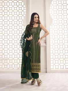 This great winter ensemble from Malaika Arora is perfect for your next special occasion. It includes a bottle green kurta set crafted from silk blend brocade, cotton and organza. Featuring Zari woven designs, a U-neck and calf length trousers, this set is sure to make a statement. It is dry clean only and designed specifically by the Bollywood Diva herself. TOP: Silk Blend(Brocade), TOP INNER: Cotton, BOTTOM: Cotton, DUPATTA: Organza, Dry Clean Stitched Salwar Designs, Cotton Suit Designs Sleeveless, Brocade Kurta Set, Bottle Green Suits Women Indian, Green Suit Designs Indian Style, Sleeveless Long Kurti, Sleeveless Salwar Designs, Green Kurta Set Women, Kurta Designs Women Sleeveless