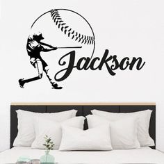 a bedroom with a baseball wall decal on the wall