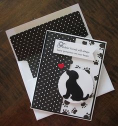 two cards with black and white designs on them, one has a dog's silhouette