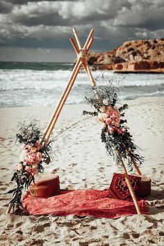 an outdoor ceremony setup on the beach