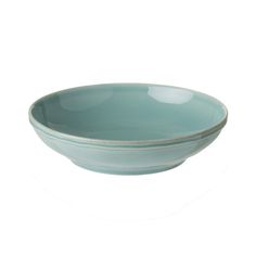 a blue bowl sitting on top of a white table