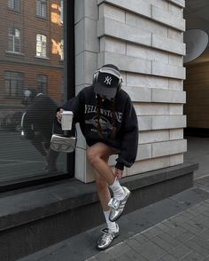 Credit to @cheriedari on Instagram for blessing us with this drippy outfit. People don't usually combine mini-skirts and sweatshirts but it really works out perfectly in cases such as this. The baseball hat adds to the aesthetic but what really stands out are the silver Adidas samba shoes that make the greatest impact on the whole outfit. Be sure to try this out soon! Silver Adidas Samba Outfit, Wales Bonner Samba Silver Outfit, Adidas Samba Wales Bonner Outfit, Silver Samba Outfit, Onitsuka Silver, Adidas Wales Bonner Outfit, Wales Bonner Samba Outfit, Silver Sambas, Silver Sneakers Outfit