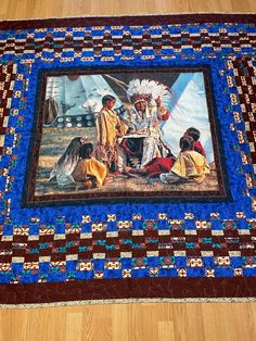 an image of native american indians on a quilt