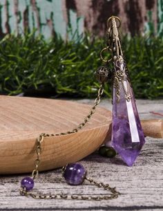 Clear Amethyst  Crystal Pendulum,Polished Gemstone Necklace,Healing Dowsing Energy Balancing,Rose Pendulum,Rose Pendant,Reiki,Chakra,JewelrySize: 70 mmChain Color: Copper/SilverPick at random. Mystical Purple Crystal Necklace For Healing, Purple Crystal Necklace For Meditation, Purple Spiritual Crystal Necklace For Festivals, Spiritual Purple Crystal Necklace For Festivals, Lavender Spiritual Crystal Pendant Necklace, Purple Spiritual Crystals For Jewelry Making, Lavender Pendant Crystal Necklace For Spiritual Use, Purple Spiritual Crystal Necklace, Spiritual Purple Crystal Pendant