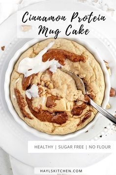 A pretty and pretty Fudgy Cinnamon Protein Mug Cake complete with a swirl and icing. This healthy cinnamon roll protein mug cake uses protein powder, and has no flour or sugar - an easy and keto friendly dessert! Healthy Cinnamon Roll, Cinnamon Mug Cake, High Protein Muffins, Cake Sizes And Servings, Healthy Cinnamon Rolls