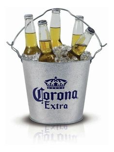 six bottles of corona beer in an ice bucket