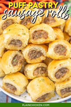 sausage rolls on a plate with carrots in the background and text overlay that reads puff pastry sausage rolls