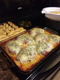 some food is laying out on a baking sheet in the oven and ready to be cooked