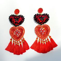 Add a vibrant touch to your outfit with our Layla Red Heart Tassel/Fringe Handmade Statement Earrings. These unique earrings feature beautifully crafted red heart-shaped tassels that sway gracefully with every step you take. Handmade with love, they are the perfect accessory to express your individuality and make a bold fashion statement. Whether you're dressing up for a special occasion or adding a pop of color to your everyday look, these earrings are sure to turn heads and spark conversations. Elevate your style with the eye-catching beauty of Layla Red Heart Tassel/Fringe Handmade Statement Earrings. Heart Tassel, Every Step You Take, Tassel Fringe, Bold Fashion, Unique Earrings, Red Heart, Statement Earrings, Fashion Statement, Jewelry Earrings Dangle