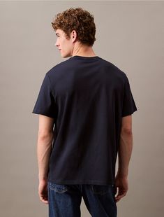 Crafted from 100% cotton, this t-shirt is soft and breathable, perfect for everyday wear. Styled with short sleeves and a crewneck. Cut in a classic fit and features a monologo graphic at the front.  Material: 100% Cotton. Logo Tee, Monogram Logo, Logo Tees, Calvin Klein, Everyday Wear, Short Sleeves, Monogram, Relaxed Fit, Crew Neck