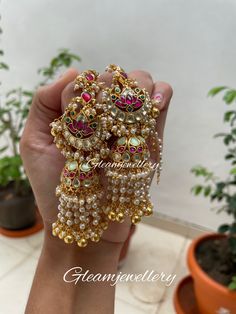 Lets play with mint. Added a twist to out pretty pachi kundan lotus earings with golden ball hangings giving a chandelier look supported with de attach able kundan ear chain Cheap Kundan Earrings As Gift, Luxury Green Jhumkas With Stone Work, Cheap Heavy Chandbali Jhumkas, Luxury Green Elegant Jhumkas, Luxury Hand Set Jhumkas For Festivals, Luxury Latkans Earrings For Festivals, Luxury Fusion Style Chandbalis With Meenakari, Luxury Kundan Jhumkas With Gota Work, Luxury Fusion Chandelier Earrings With Latkans