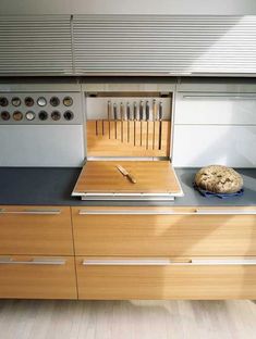 a kitchen counter with a cutting board and knife