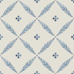 a blue and white pattern with leaves on the bottom, which is very similar to an ornament