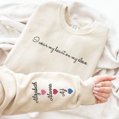 Creat Unique Personalized Gift Idea for Mom. Embroly® brand custom embroidered Mom sweatshirt hoodie for Mom, Mimi, Nanny, Grammy, Mamaw, Gran, Gran... Unique gift idea for mom birthday, Christmas or Thanksgiving, Mother's Day, family anniversary or mother wedding day, any special occasion to express gratitude and love to your mom. 🔎 Want to surprise your mom with a personalized minimalist sweatshirt that perfectly captures her style and celebrates her role as a loving grandmother?➤ Seeking a thoughtful gift for the new mom in your life, a hoodie that will make her feel embraced in the joy of grandparenthood?➤ Looking for a personalized mom sweatshirt that will bring a sense of pride and happiness every time she wears it, reminding her of the cherished moments shared with her grandkids? O Matching Sweaters, Personalized Gifts For Dad, Nana Gifts, Unique Personalized Gift, Custom Sweatshirts, Personalized Anniversary, Mom Sweatshirt, Expressing Gratitude, Personalized Embroidered