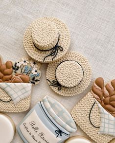 three crocheted hats are sitting next to each other on top of a table