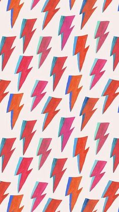 an abstract pattern with red, blue and pink lightning bolts on white paper that looks like watercolor paint