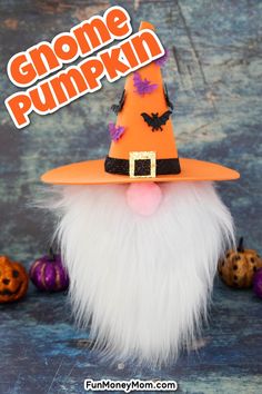 an orange gnome with white hair and a black top hat is surrounded by pumpkins