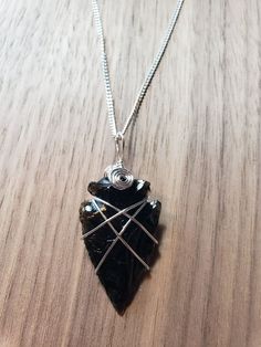 This black obsidian arrowhead pendant is carefully wire wrapped using a silver plated wire. Hangs from a 24 inches silver plated chain. Perfect for layering or as a statement piece. An awesome gift for a male friend or yourself. comes with a 24 inches Silver plated chain Please note that our product is handmade. Therefore each piece is unique. Photos provided are just samples of the few that we have. The one you'll receive will be very similar but not the exact one pictured. Slight variation like color, size and minor marks are to be expected. This gives each pendant personality and uniqueness in its own way. If you have any additional questions please message me and I will get back to you quickly! Thank you so much for your support! Check out my other necklaces at: https://www.etsy.com/sh Block Negative Energy, Raw Obsidian, Beading Necklace, Obsidian Arrowhead, Slay Outfits, Talisman Pendant