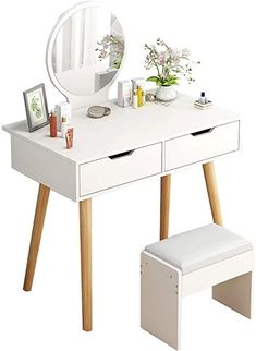 a white dressing table with stool and mirror on it's side, in front of a white background