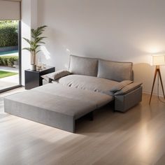 a living room filled with furniture and a sliding glass door