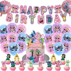 a birthday cake surrounded by cupcakes and decorations