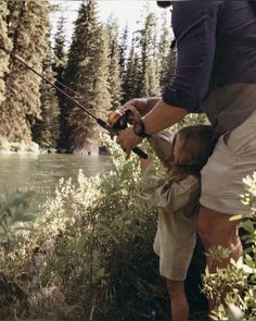 a father and daughter fishing on the river