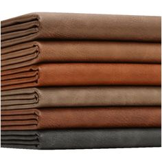 four different colors of leather sheets stacked on top of each other, with one folded in half