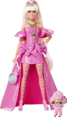 a barbie doll is standing next to a toy