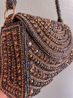 You don't have to be famous to live out your own red-carpet moment! our unique gorgeous handmade bags will help you in this. Emirates, Moroccan and Turk style in a single version. It's not just a bag this piece of art! Almost all bags presented in a single copy. The sparkling golden rhinestones glimmer, and beautiful tiny strap adds even more sparkle to this bag. With its lined interior, fits just the essentials. Carpet Bag Purse, Fancy Handbags, Suede Tote Bag, Tiny Bag, Straw Beach Bag, Silver Bags, Embellished Bags, Crystal Bags, Carpet Bag