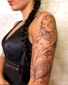 a woman with a tattoo on her arm