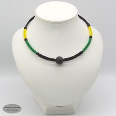 A unique macramé choker necklace with black Agate and gold plated closure. Special features include a Obsidian centre stone.  Gemstones - Silver Obsidian & Black Agate. Theme - Jamaica flag colours  Material - S-Lon Cord (nylon) Closure - Bolt ring  Sizes available - 14 inches up to 16.5 inches. Adjustable Onyx Choker Necklace, Handmade Adjustable Onyx Crystal Necklace, Paracord Braids, Silver Obsidian, Jamaica Flag, Bolt Ring, Braided Necklace, Paracord Bracelets, Black Agate