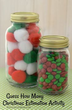 two glass jars filled with candy on top of a table