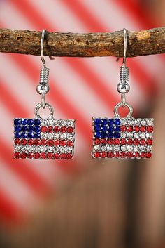 Accentuate your patriotic style with our Fiery Red Rhinestone USA Flag Squared Drop Earrings. Featuring a dazzling rhinestone design, these earrings are perfect for any occasion and showcase your love for the USA. With their bold and striking look, you'll make a statement wherever you go. Patriotic Fashion, Two Piece Short Set, Graphic Tank Tops, Fiery Red, Graphic Apparel, Red Rhinestone, Rhinestone Designs, Loungewear Set, Flag Design