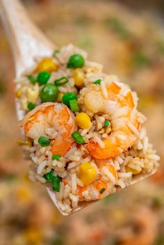 rice with shrimp and peas on a spoon