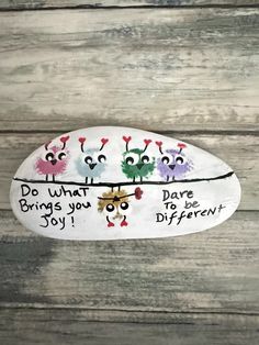 a painted rock that says do what brings you dare to be different