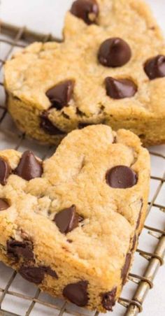 three chocolate chip cookies cooling on a wire rack