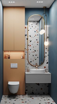 a bathroom with a toilet, sink and mirror on the wall next to each other