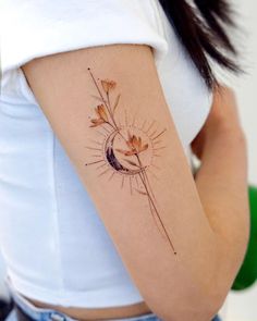 a woman's arm with a flower tattoo on the left side of her body