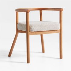 a wooden chair with a white cushion on it