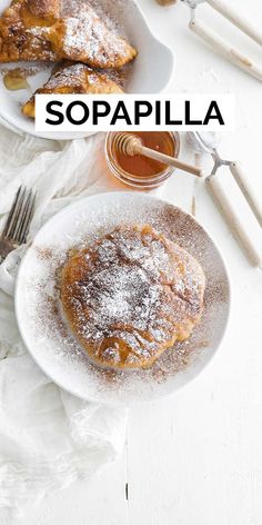 two white plates topped with powdered sugar covered desserts