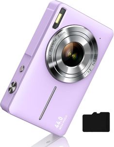 a purple digital camera sitting on top of a table